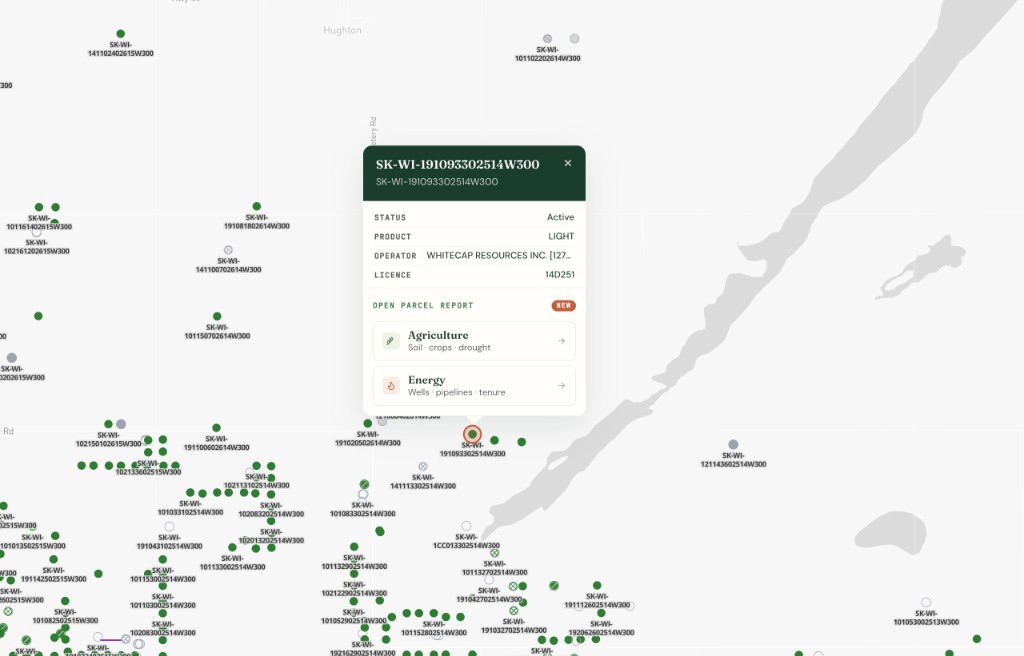 Saskatchewan wells on the DLS grid with well status, operator, and parcel report popup