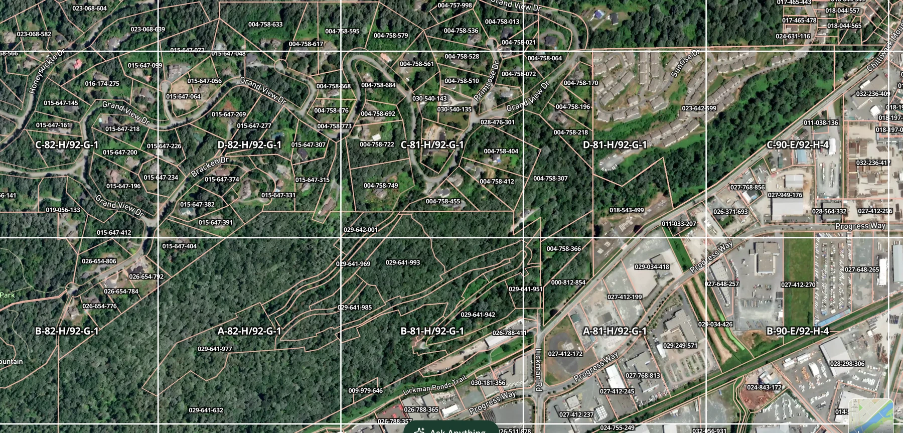 ParcelMap BC registered parcel boundaries and PID labels over the NTS survey grid near Chilliwack