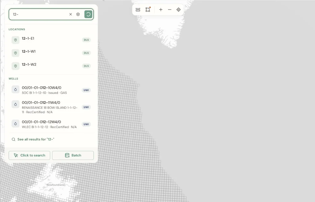 Autocomplete dropdown with system type badges for DLS locations and UWI wells