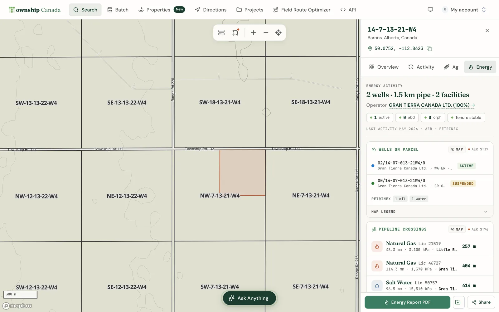The Energy tab of a parcel report for 14-7-13-21-W4 near Barons, Alberta, showing 2 wells, 1.5 km of pipe and 2 facilities, the operator, the wells on the parcel with their status, and the pipeline crossings