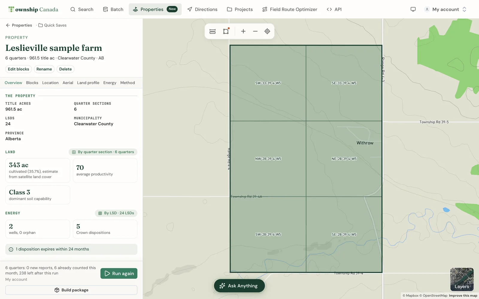 A six-quarter property workspace near Leslieville, Alberta, showing title acres, municipality, cultivated acres, average productivity, dominant soil class, wells and Crown dispositions, with the Run again and Build package controls and the property outlined on the map