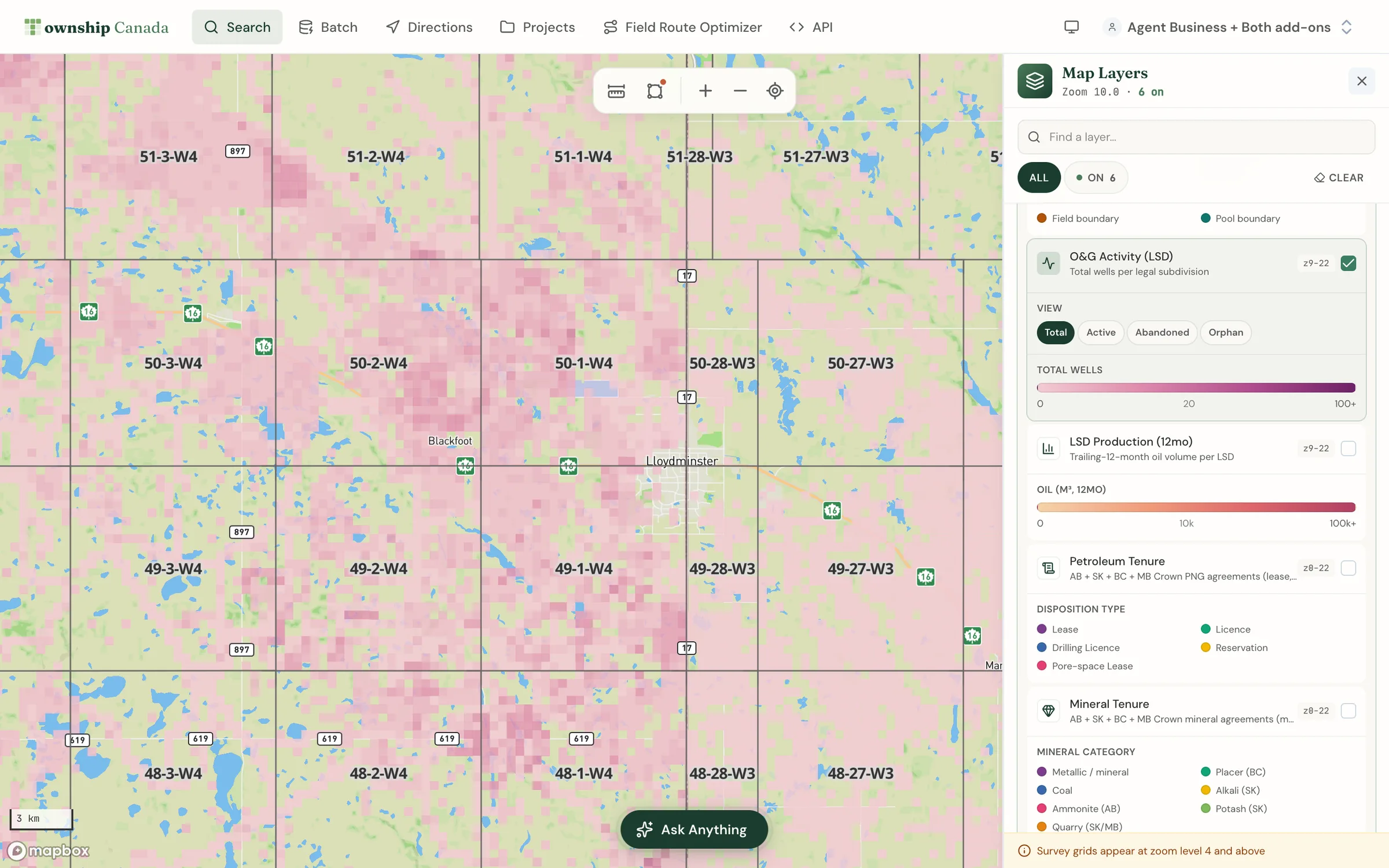 The O&G Activity layer across the Alberta-Saskatchewan border near Lloydminster, with well activity shaded continuously on both sides of the line
